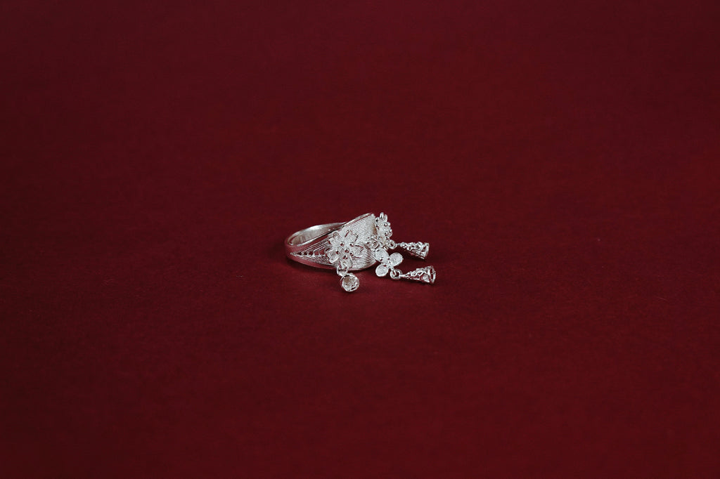 Nuya Ring – three-quarter view showing filigree band and floral cluster
